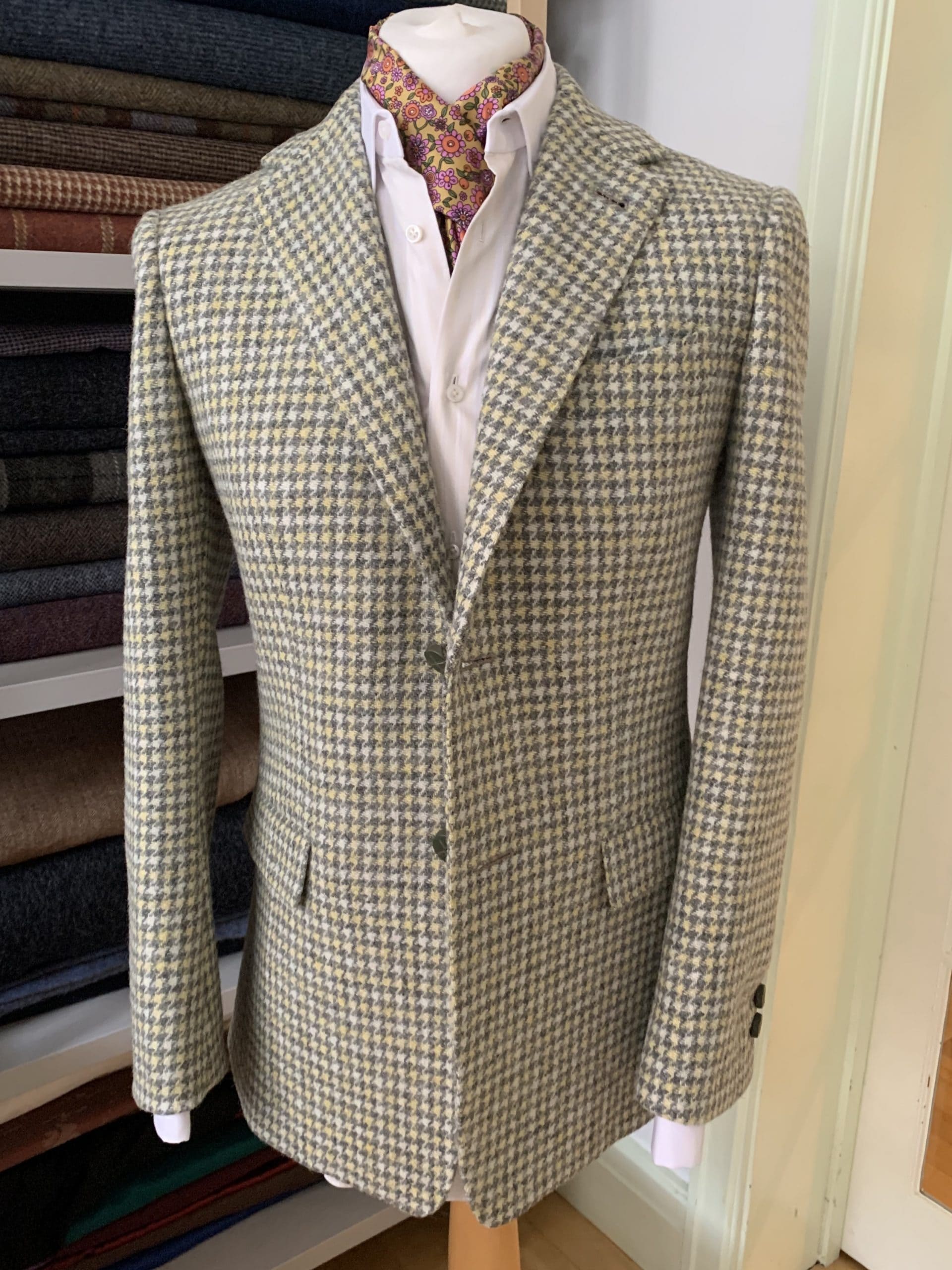 A beige suit on a mannequin